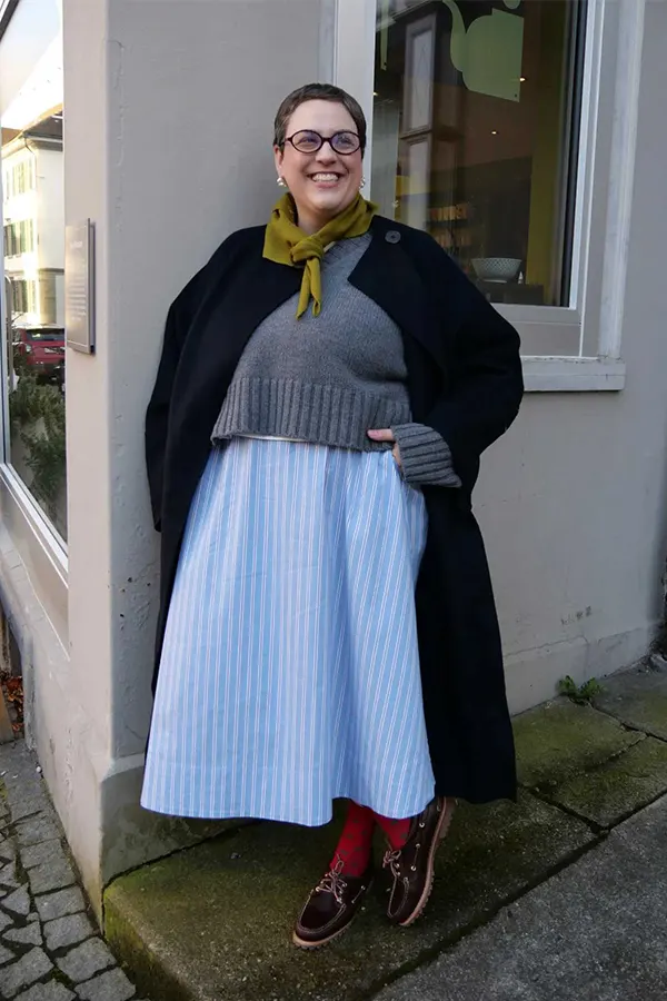 Black Coat Over A Soft Blue Dress
