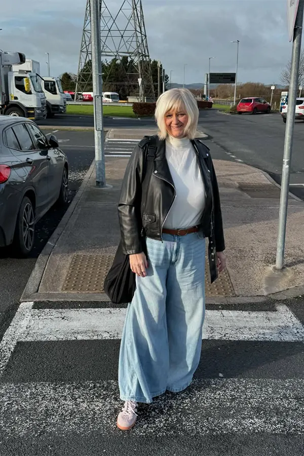 Black Leather Jacket With Wide Leg Jeans For A Modern Casual Style