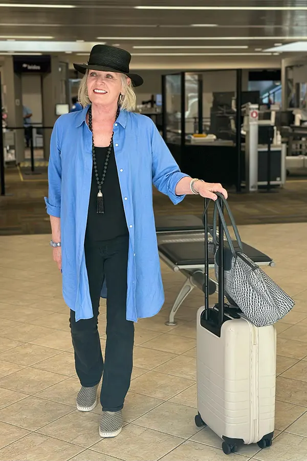 Blue Long Cardigan With A Simple Black Travel Base