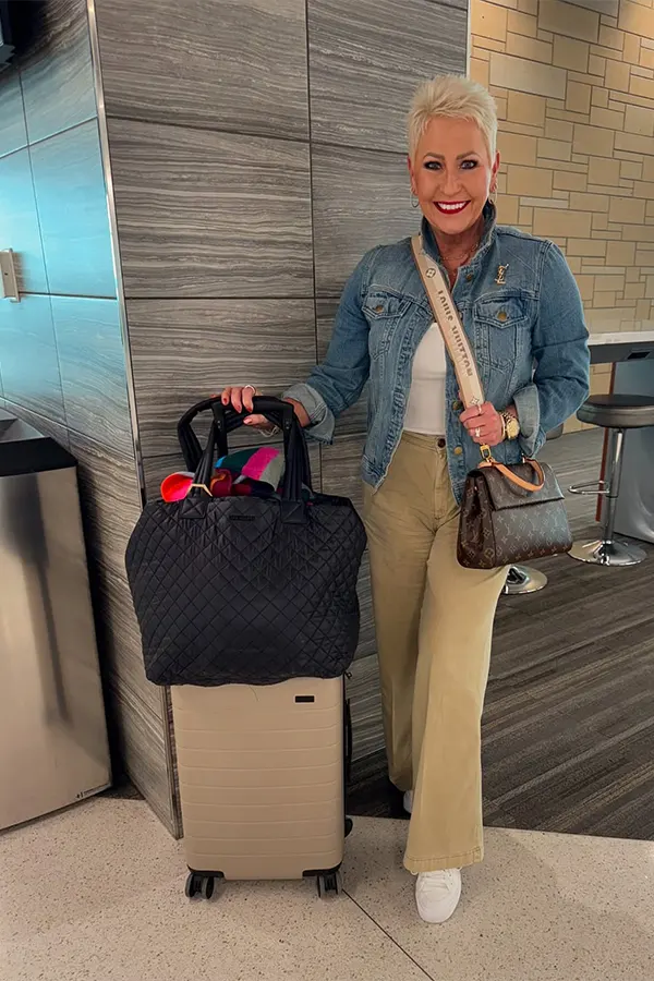 Denim Jacket And Beige Pants For A Smart Casual Flight Outfit