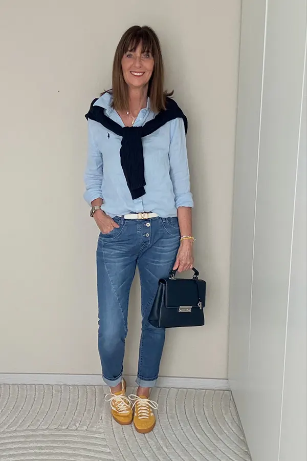 Layer A Navy Sweater Over A Light Blue Shirt