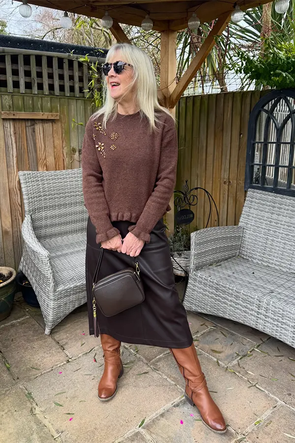 Let A Brown Knit Anchor A Flowing Midi Skirt