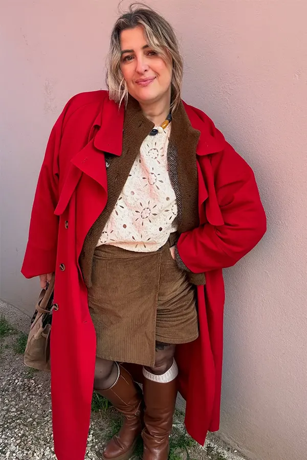 Red Coat With White Blouse And Brown Shorts