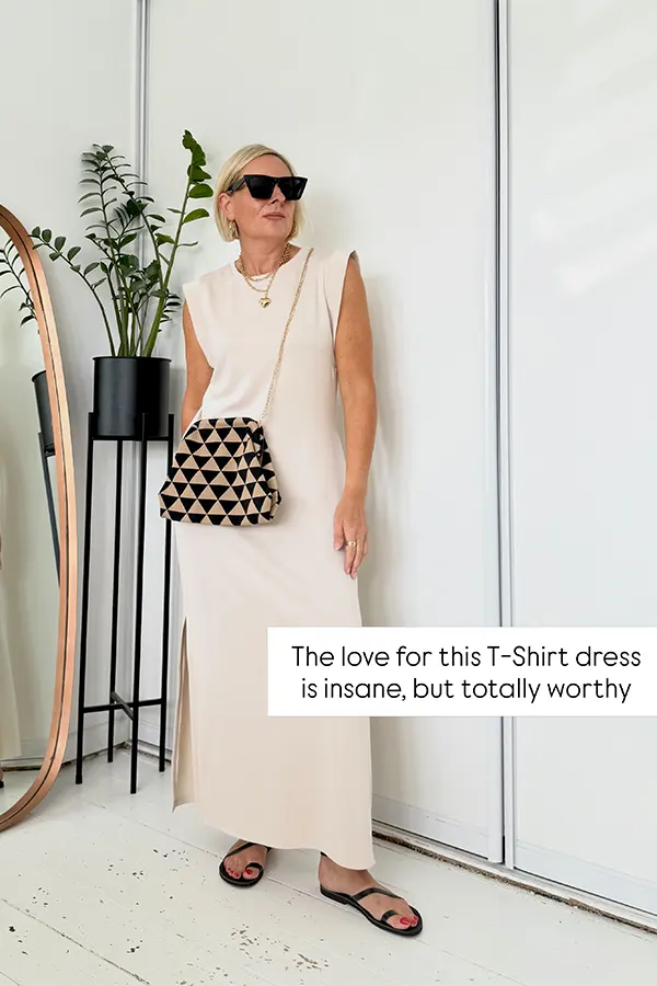 Sleeveless Cream Dress With Flat Sandals And A Woven Bag