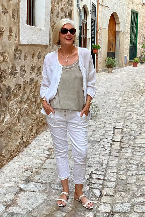 White Layers And Cropped Trousers For A European Feel