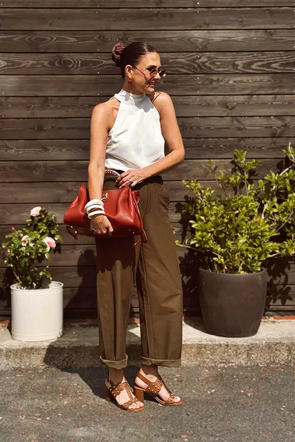 White Sleeveless Top With Relaxed Brown Trousers