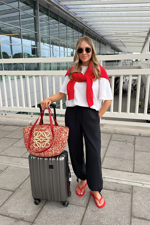 White Top With Black Pants For A Polished Flight Look