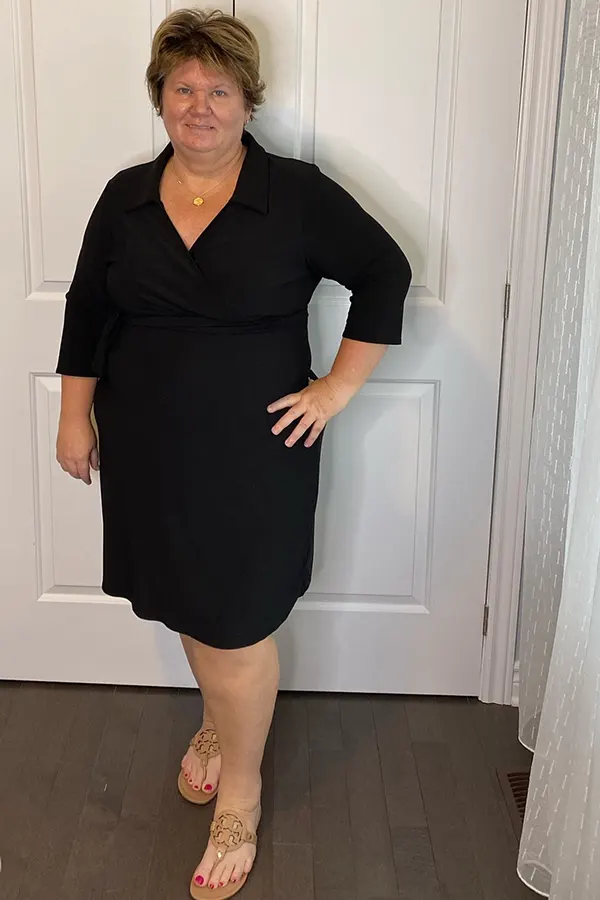 A Black Collared Dress With A Defined Waist
