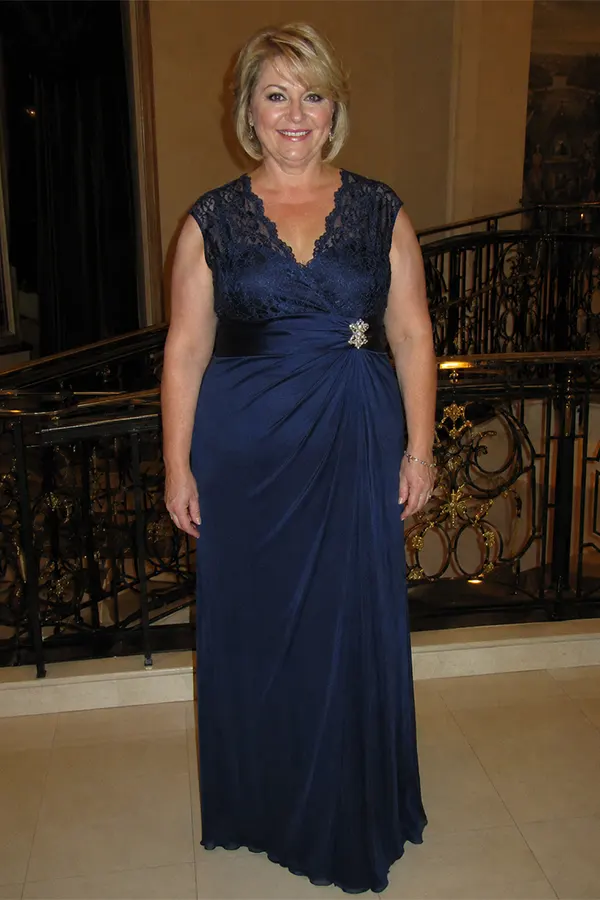 A Navy Lace Detail Gown With A Draped Waist