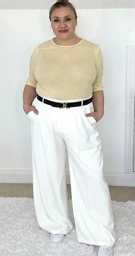 A Soft Cream Top With Wide Leg White Pants