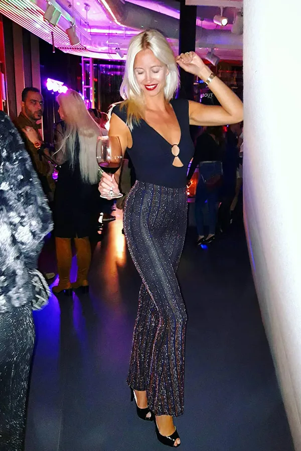 Add Subtle Sparkle With A Black Top And Shimmering Pants
