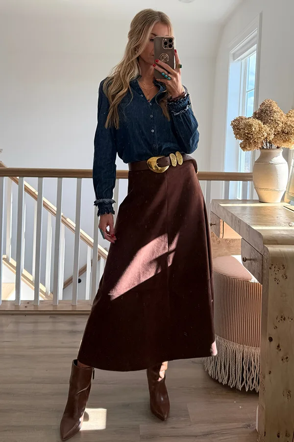 Add A Feminine Touch With A Blouse And Flowing Midi Skirt