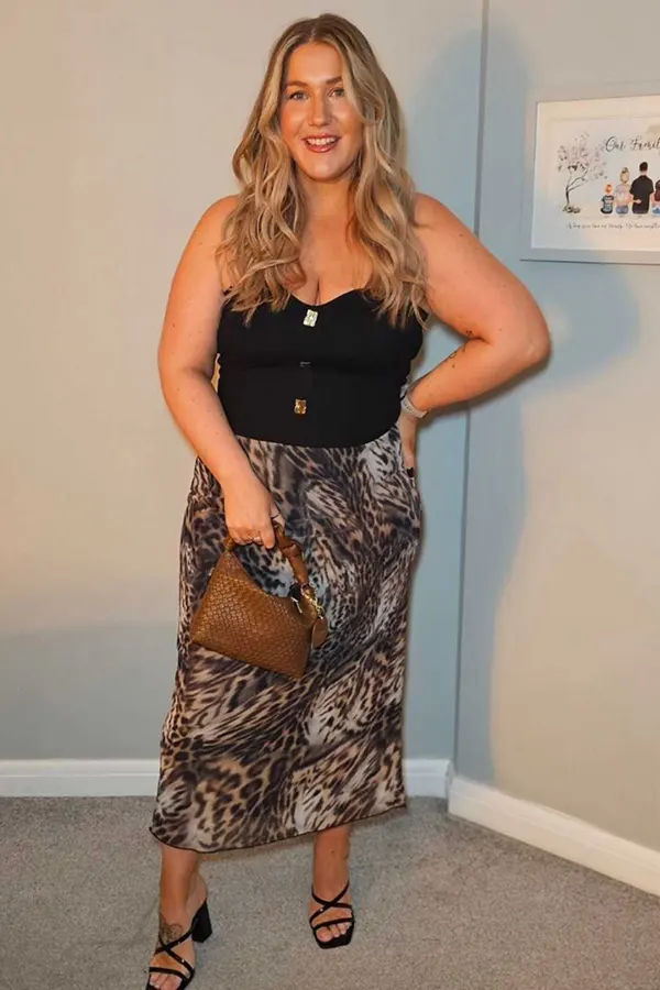 Black Fitted Top With A Patterned Midi Skirt