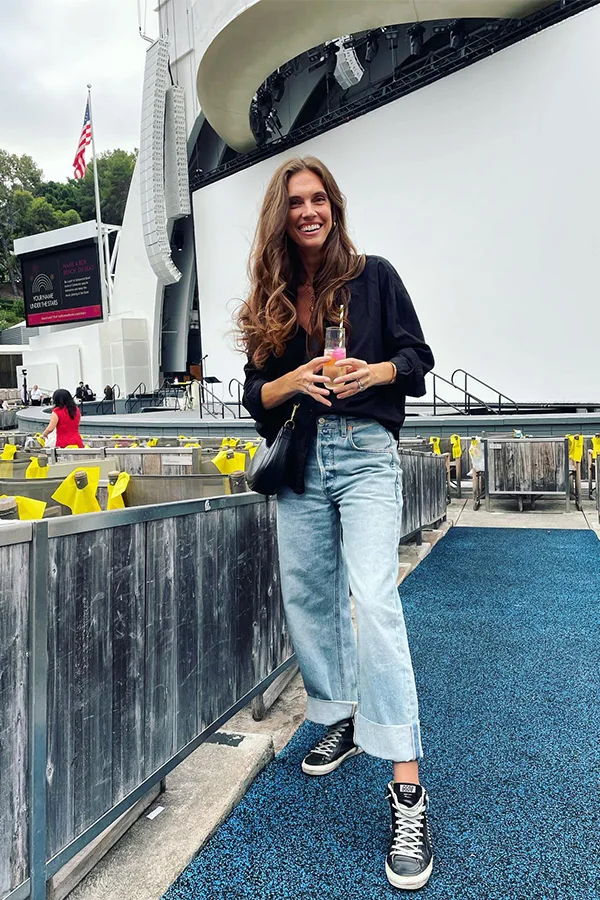 Black Top With Relaxed Jeans And Sneakers