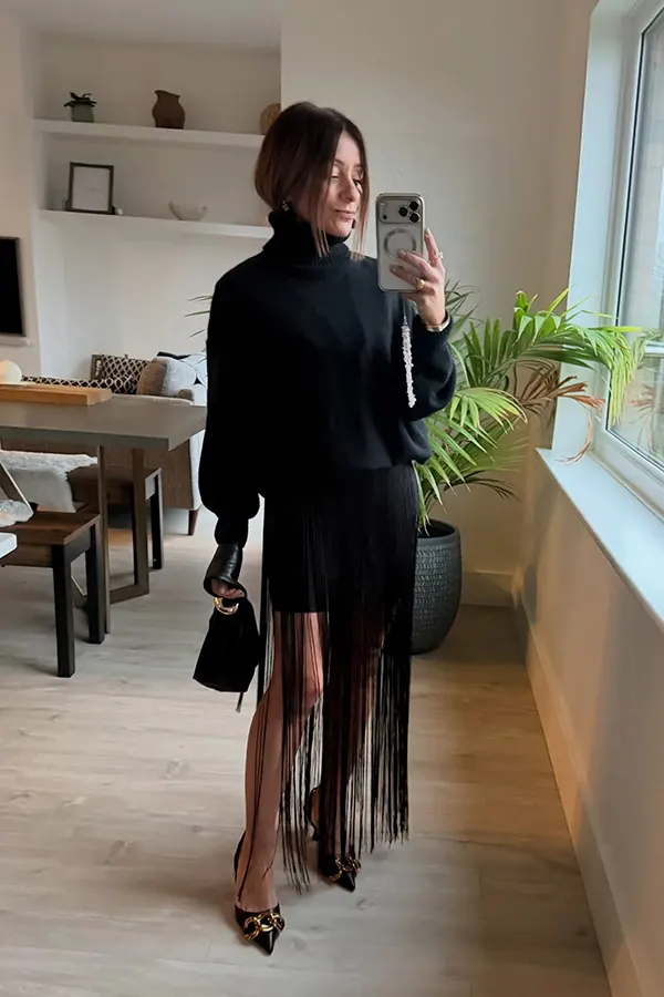 Black Turtleneck With A Sheer Fringe Hem Skirt