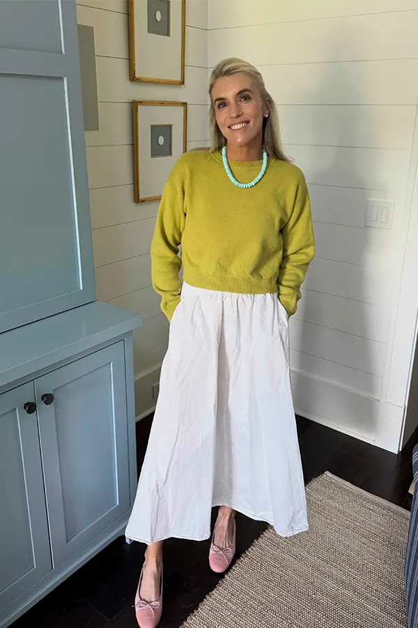 Bright Sweater With A Flowing White Skirt