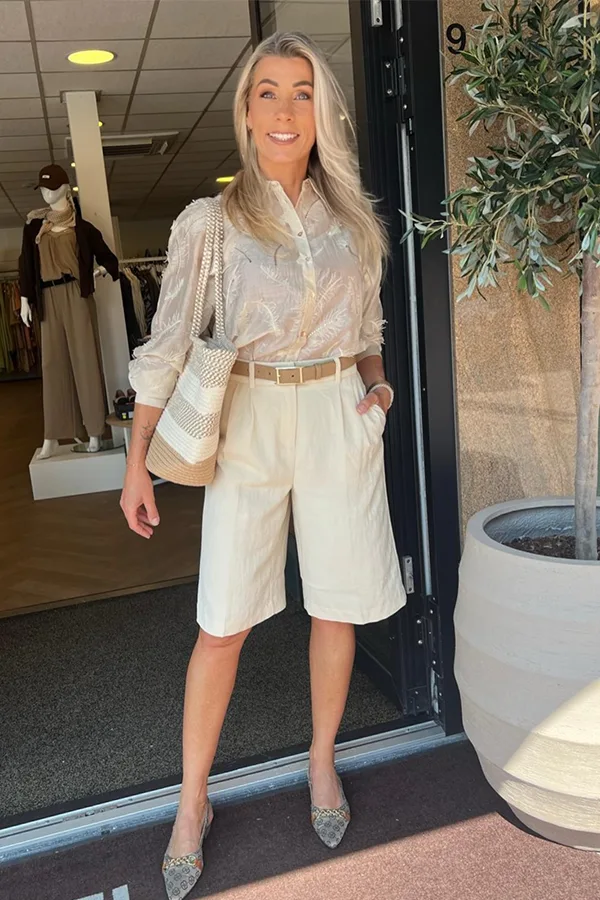 Cream Blouse And White Jorts With A Waist Belt