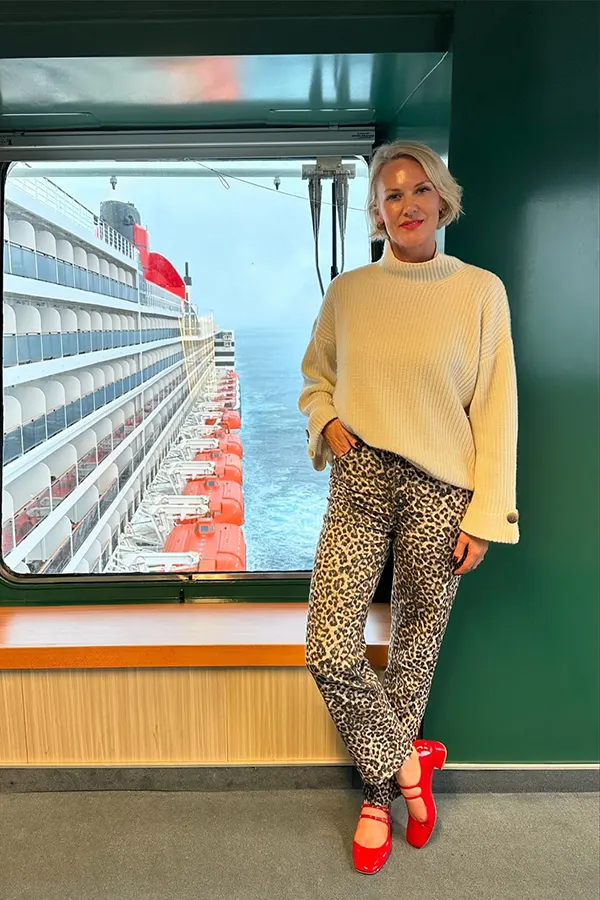 Cream Sweater Patterned Pants And Red Shoes