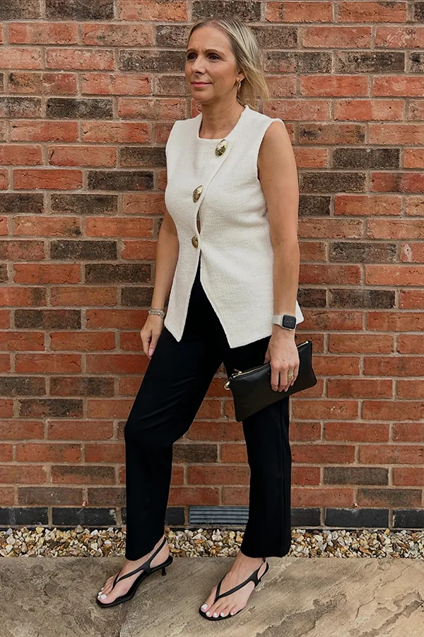Cream Waistcoat Over Black For A Slim Simple Base