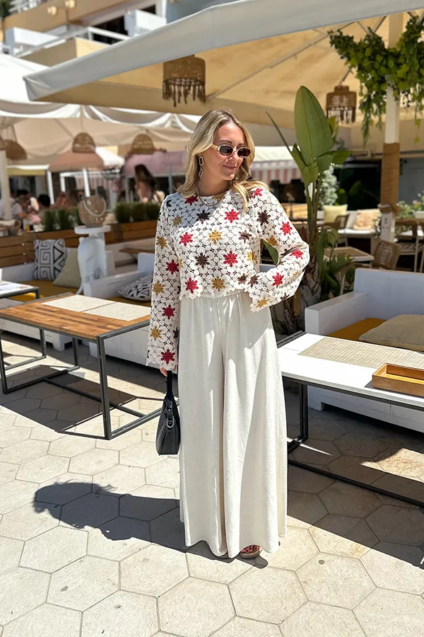 Floral Blouse With Flowing White Trousers