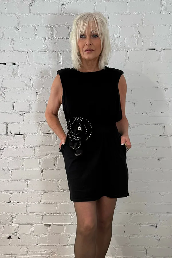 Keep It Classic With A Sleeveless Black Mini Dress