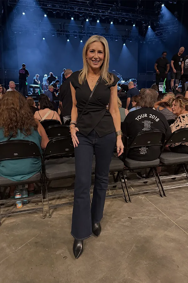 Keep It Sleek With A Black Wrap Style Top And Flared Pants