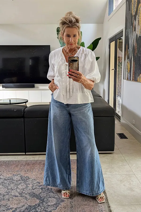 Make Wide Leg Jeans Look Polished With A Light Blouse