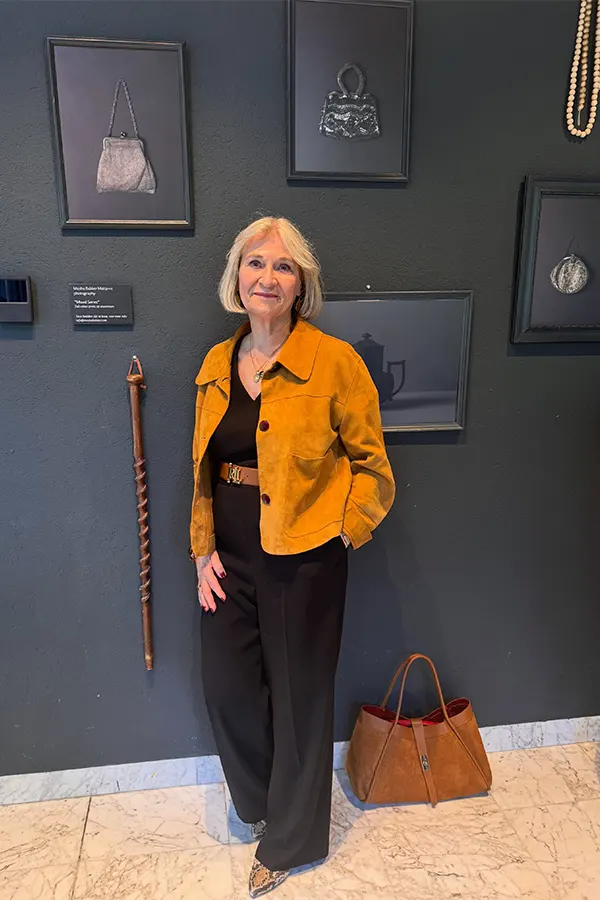 Mustard Jacket Over A Black Jumpsuit