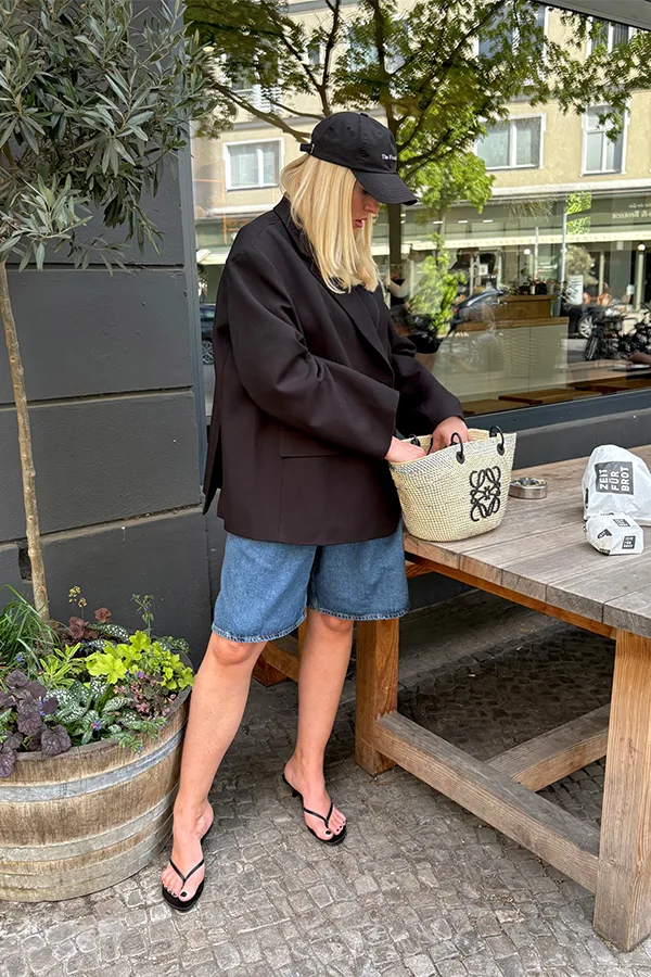 Oversized Dark Jacket With Jorts For A Relaxed Layered Look