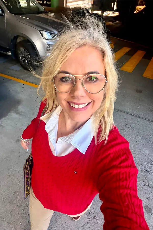 Red Sweater Layered Over A Crisp White Collar