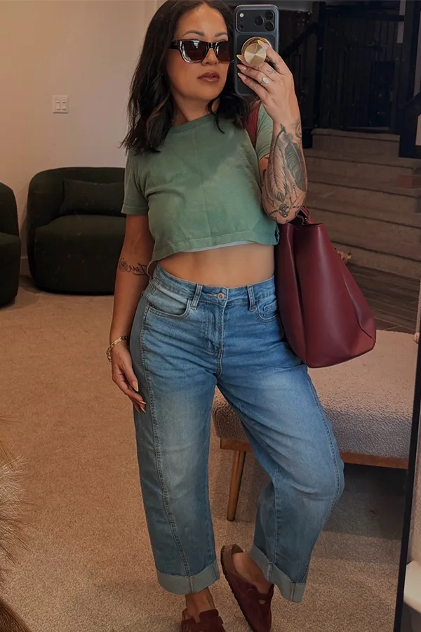 Sage Green Crop Top With Relaxed Jeans And A Burgundy Tote