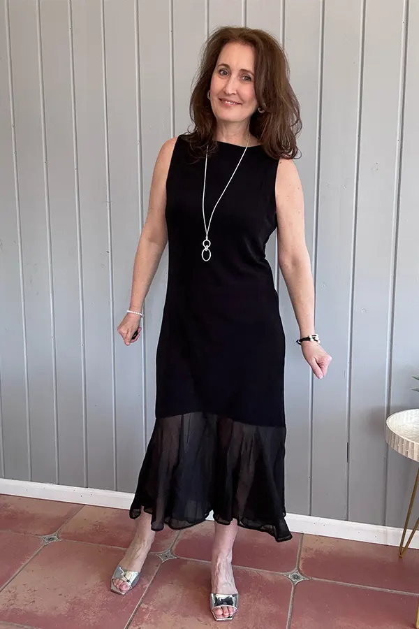 Simple Black Dress With A Soft Flowing Hem