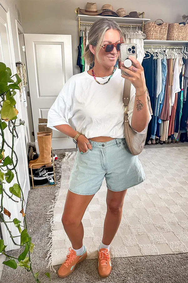 White Crop Top With Light Denim Shorts And Bright Sneakers
