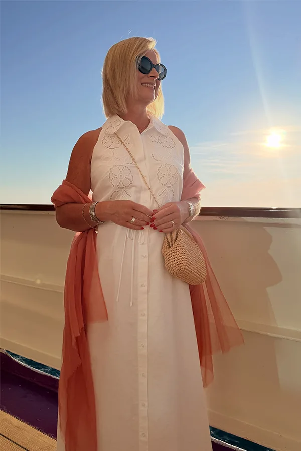 White Dress With A Coral Wrap For An Elegant Sunset Look