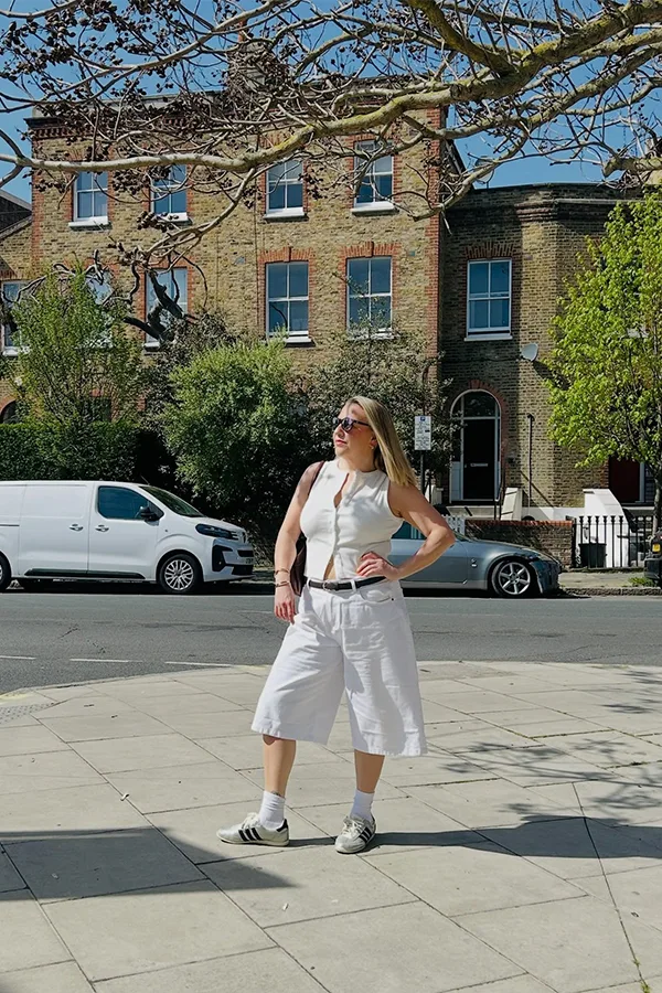White Jorts With A Sleeveless Top And Sneakers