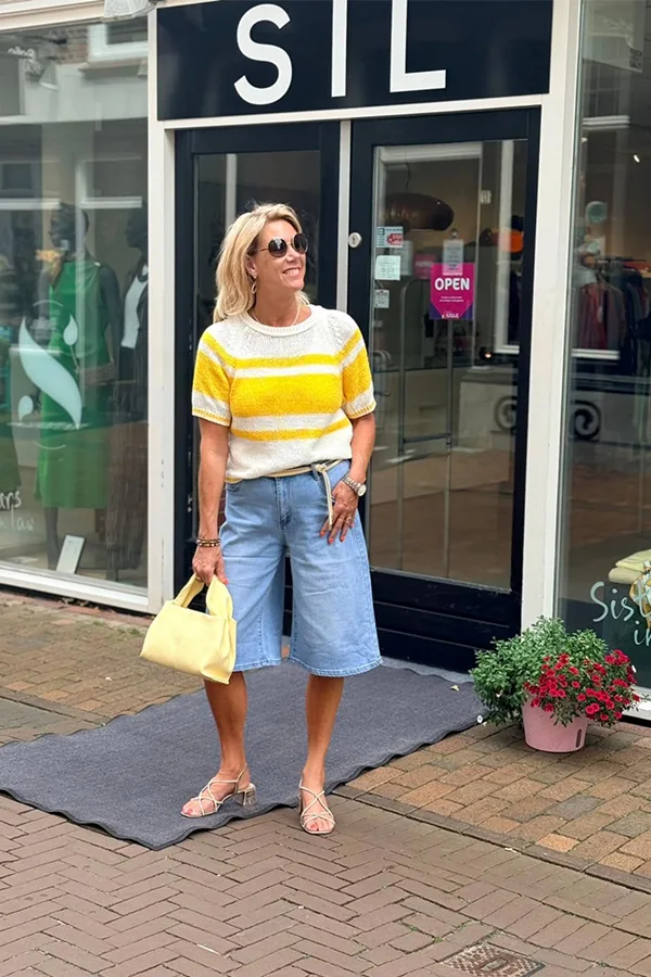 Yellow Striped Top With Light Wash Jorts And A Yellow Bag