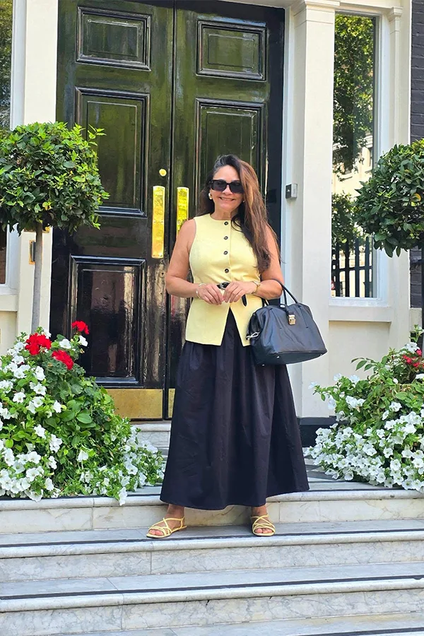 Yellow Waistcoat With A Long Black Skirt