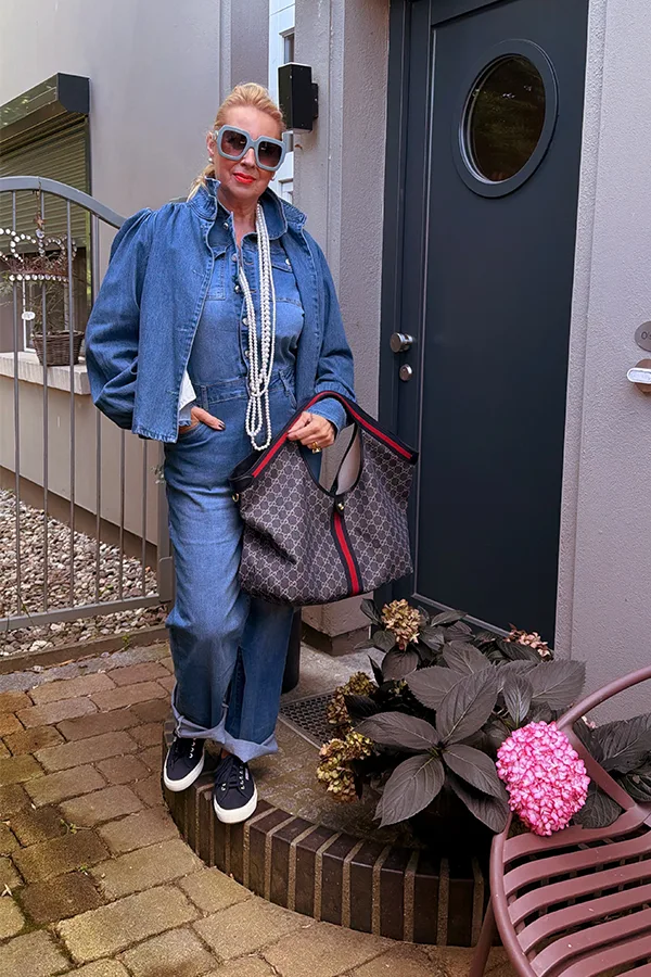 Layered Denim Jumpsuit With Statement Necklace