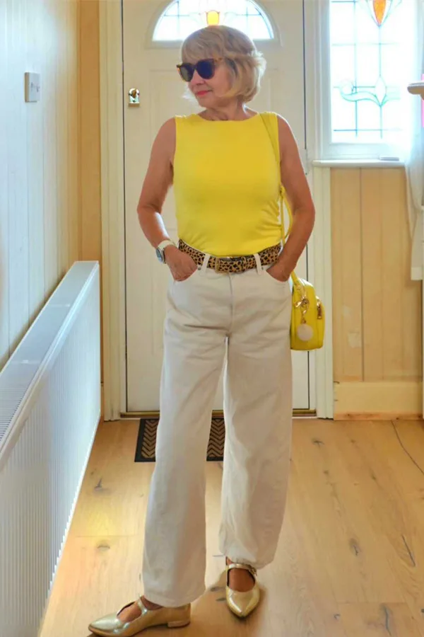 Sleeveless Yellow Top With Cream Trousers